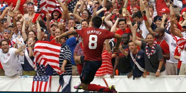 United States' Clint Dempsey (8) reacts after his goal during the second half of a CONCACAF Gold Cup quarterfinal soccer match against Jamaica on Sunday, June 19, 2011, at RFK Stadium in Washington. The United States won 2-0. (AP Photo/Alex Brandon)