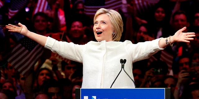 Democratic presidential candidate Hillary Clinton gestures as she greets supporters at a presidential primary election night rally, Tuesday, June 7, 2016, in New York. (AP Photo/Julio Cortez)