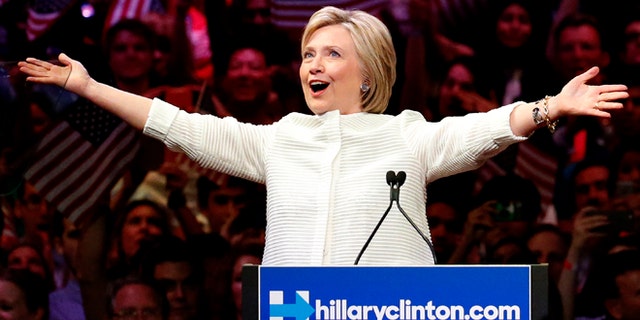 Democratic presidential candidate Hillary Clinton gestures as she greets supporters at a presidential primary election night rally, Tuesday, June 7, 2016, in New York. (AP Photo/Julio Cortez)