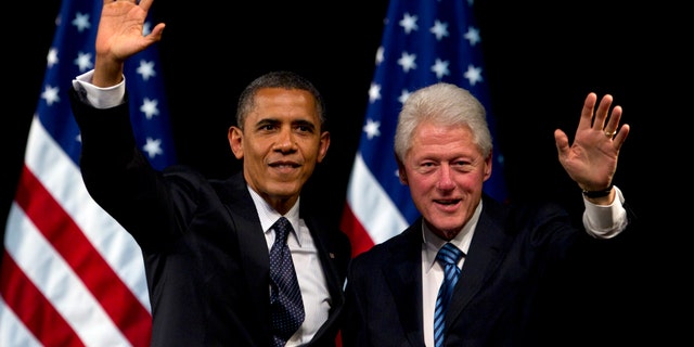 June 4, 2012: President Barack Obama and former President Bill Clinton wave to the crowd during a campaign event at the New Amsterdam Theater in New York.