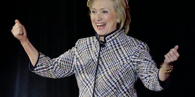 Hillary Rodham Clinton reacts to applause from the crowd before speaking during the sixth annual Women in the World Summit, Thursday, April 23, 2015, in New York. (AP Photo/Julie Jacobson)