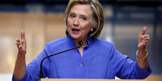 Aug. 10: Democratic presidential candidate Hillary Clinton answers reporters questions after announcing her college affordability plan at the high school in Exeter, N.H.
