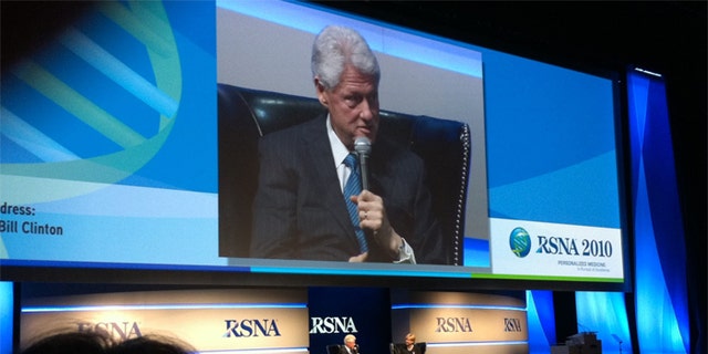 Clinton's appearance raised concerns among members of the Radiological Society of North America, who wanted to know who paid the bill.