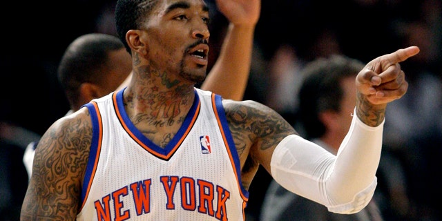 April 25, 2012: New York Knicks' J.R. Smith (8) reacts to teammates after scoring during the second half of an NBA basketball game.