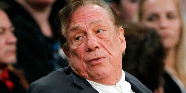 FILE - In this Dec. 19, 2011, file photo, Los Angeles Clippers owner Donald Sterling gestures while watching the Clippers play the Los Angeles Lakers during an NBA preseason basketball game in Los Angeles. (AP Photo/Danny Moloshok, File)
