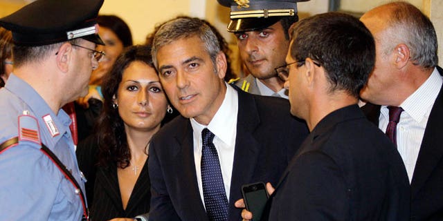 July 16: Actor George Clooney leaves a tribunal in Milan, Italy. Clooney appeared in court as a witness in a fraud trial against defendants charged with co opting his name for a line of clothing.