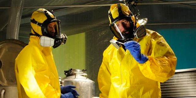 Jesse Pinkman, played by Aaron Paul, left, and Walter White, played by Bryan Cranston, cooking meth in a home being fumigated in the fifth season of "Breaking Bad."