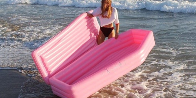 A millennial-pink, coffin-shaped pool float is the new summer must-have, according to the internet.