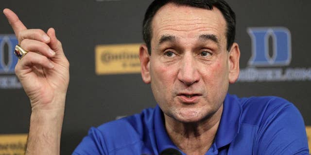 FILE - In this Sept. 18, 2014, file photo, Duke basketball coach Mike Krzyzewski speaks to members of the media during a press conference in Durham, N.C. Duke is No. 4 in The Associated Press preseason Top 25.(AP Photo/Gerry Broome, File)
