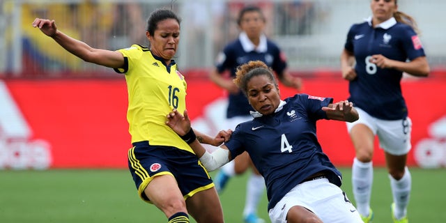 Lady Andrade and Laura Georges at Moncton Stadium on June 13, 2015 in Moncton, Canada.