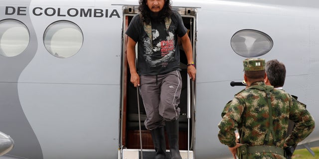 Sept. 10, 2012: Former hostage Orlando Sigifredo Ibarra Sarmiento exits a plane at a military base in Bogota, Colombia.