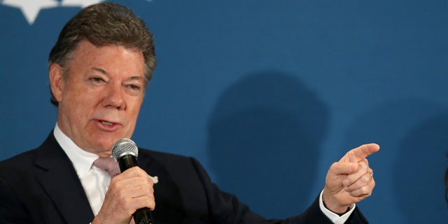 CORAL GABLES, FL - DECEMBER 11: Juan Manuel Santos, President of the Republic of Colombia, (L) and Susan Fonseca, Founder/CEO Woman@TheFrontier and Founding Member, Singularity University attend the Clinton Foundations Future of the Americas summit at the University of Miami  on December 11, 2014 in Coral Gables, Florida. The summit is bringing together leaders from the private, public, and civic sectors across Latin America, the Caribbean, Canada, and the United States to work on economic prosperity, investment, and innovation opportunities across the Western Hemisphere.  (Photo by Joe Raedle/Getty Images)