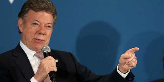 CORAL GABLES, FL - DECEMBER 11: Juan Manuel Santos, President of the Republic of Colombia, (L) and Susan Fonseca, Founder/CEO Woman@TheFrontier and Founding Member, Singularity University attend the Clinton Foundations Future of the Americas summit at the University of Miami on December 11, 2014 in Coral Gables, Florida. The summit is bringing together leaders from the private, public, and civic sectors across Latin America, the Caribbean, Canada, and the United States to work on economic prosperity, investment, and innovation opportunities across the Western Hemisphere. (Photo by Joe Raedle/Getty Images)