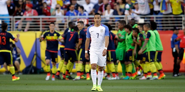 Colombia's players celebrate after scoring their first goal as United States' Bobby Wood, center, walks away during a Copa America Centenario Group A soccer match at the Levi's Stadium in Santa Clara, Calif., Friday, June 3, 2016. Colombia scored 2 first-half goals beating the US in the opener of the Copa America.(AP Photo/Marcio Jose Sanchez)