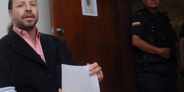 FILE - In this June 5, 2007 file photo, former paramilitary leader Freddy Rendon sits inside a court before a hearing in Medellin, Colombia. Rendon, better known by his alias “the German”, was released from jail Thursday, July 30, 2015. He is the most senior paramilitary commander to be freed after completing the maximum eight years stipulated in a law for former militia members who confess their war crimes to prosecutors and compensate victims. (AP Photo/ Luis Benavides, File)