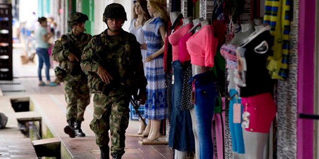 Soldiers patrol in Puerto Rico, southern Colombia, on Sept. 21, 2016 .