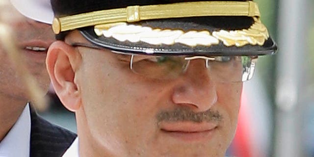 July 19: United Arab Emirates Col. Arif Mohamed Saeed Mohamed Al-Ali enters Federal Court in Providence, R.I. The trial of the United Arab Emirates naval officer accused of keeping an unpaid servant in his Rhode Island home, was put on hold for two days after the defense raised concerns about the accuracy of the translation service provided by an interpreter.