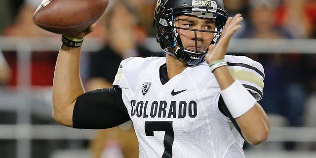 Colorado quarterback Jordan Gehrke throws against Arizona during the second half of an NCAA college football game, Saturday, Nov. 8, 2014, in Tucson, Ariz. Gehrke replaced the injured Sefo Liufau. (AP Photo/Rick Scuteri)