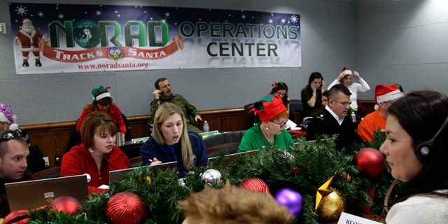 Dec. 24, 2012: Volunteers take phone calls from children asking where Santa is and when he will deliver presents to their house, during the annual NORAD Tracks Santa Operation, at the North American Aerospace Defense Command, or NORAD, at Peterson Air Force Base, in Colorado Springs, Colo.