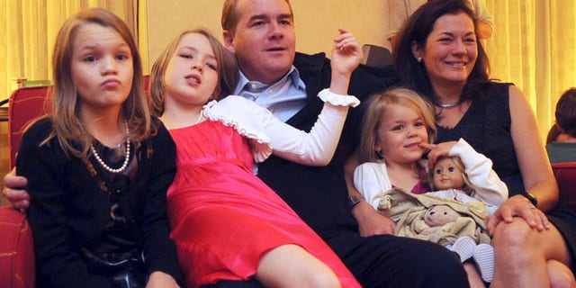 Nov. 2: Democratic candidate for Senate Michael Bennet, center, watches election results with his family at the Marriott in Denver. Into the early hours of the next day, election numbers seemed too close to call.