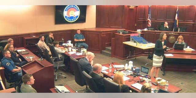 In this image taken from video, defense attorney Tamara Brady, right, gestures during closing arguments in the sentencing phase of the James Holmes trial, in Centennial, Colo., Thursday, Aug. 6, 2015. Holmes sits second from left in a light shirt. (Colorado Judicial Department via AP, Pool)