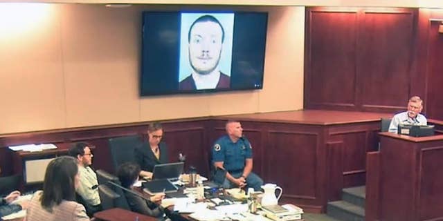 Defense attorney Tamara Brady, left, questions Robert Holmes, top right, the father of James Holmes, background left, during the sentencing phase of the Colorado theater shooting trial.
