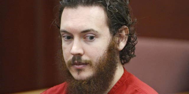 FILE - In this June 4, 2013, file photo, Aurora, Colo., theater shooting defendant James Holmes appears in court in Centennial, Colo. Taxpayer costs for the Colorado theater shooting case have risen to at least $2.2 million before the trial has even started. That figure doesn't include legal costs for the defendant. The Holmes trial is expected to start April 27. (AP Photo/The Denver Post, Andy Cross, Pool, file)