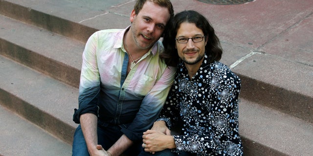 June 6, 2013: Dave Mullins, right, sits for a portrait with his husband Charlie Craig, in Denver.