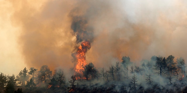 March 15, 2013: A wildfire burns out of control at Horsetooth Reservoir west of Fort Collins, Colo.