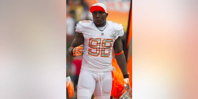 File-This Jan. 26, 2014, file photo shows Indianapolis Colts outside linebacker Robert Mathis of Team Rice during introductions on the field before the start of the NFL Pro Bowl football game at Aloha Stadium, in Honolulu. Mathis has been suspended four games for violating the league’s policy on performance-enhancing drugs. The league made the announcement Friday, May 16, 2014. In a statement, the Colts said they wanted to reassure Mathis that he would remain an “honored and cherished” member of the team. They also offered to support Mathis throughout the process. (AP Photo/Marco Garcia, File)