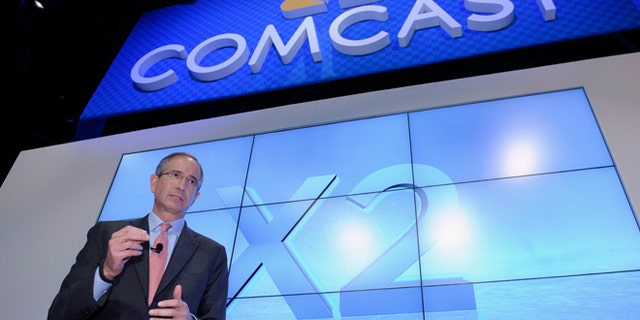 FILE - This June 11, 2013 file photo shows Comcast Corp. CEO Brian Roberts during The Cable Show 2013 convention in Washington. Comcast, the nation's biggest cable colossus, plans to swallow runner-up titan Time Warner Cable. This $45 billion deal would give Comcast 30 million subscribers in 43 of the nation's top 50 markets and about 30 percent of pay TV customers. (AP Photo/Susan Walsh, File)