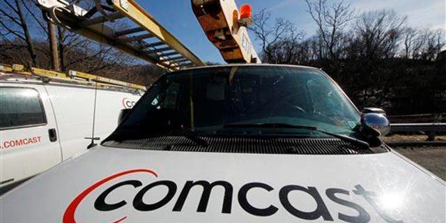 The Comcast logo is seen on a Comcast installation truck in Pittsburgh.