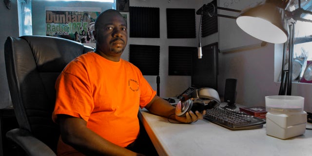 January 5: Albert Knighten sits in his darkened radio studio at his home in Fort Myers, Fla. The Federal Communications Commission shut down the pirate radio station and arrested Knighten.
