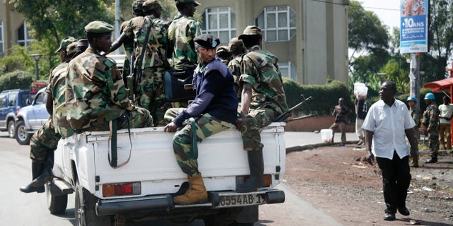 Nov. 26, 2012 - Rebels patrol around Congo's Central Bank in Goma, eastern Congo.