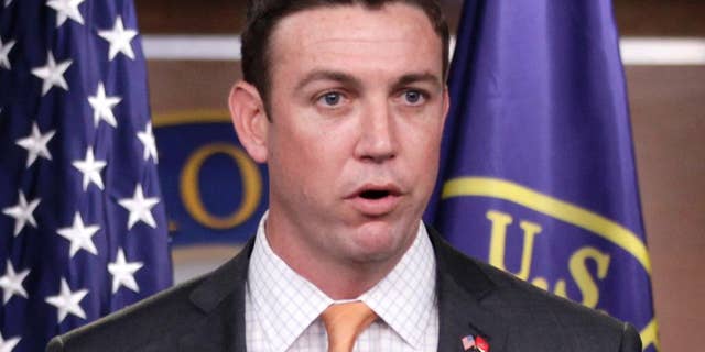 FILE - In this April 7, 2011 file photo, Rep. Duncan Hunter, R-Calif., speaks during a news conference on Capitol Hill in Washington. Hunter said he will introduce a bill on March 19, 2015, that calls on the president to task one person to lead U.S. efforts to recover American hostages. (AP Photo/Carolyn Kaster, File)