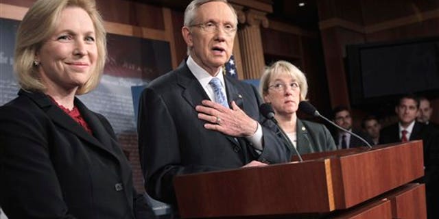 May 25: Senate Majority Leader Harry Reid of Nev., accompanied by Sen. Kirsten Gillibrand, D-N.Y., left, and Sen. Patty Murray, D-Wash., speaks to reporters on Capitol Hill in Washington. (AP)