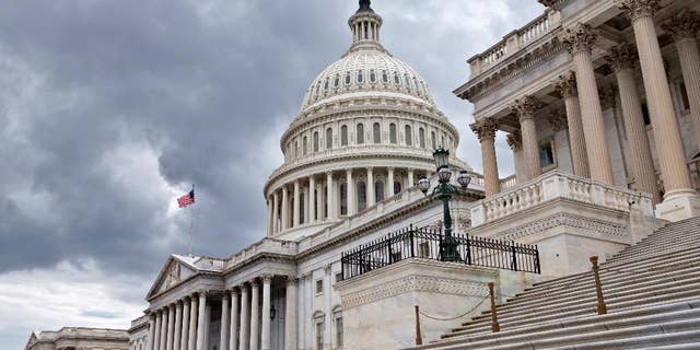 This photo taken July 23, 2013, show the U.S. Capitol in Washington. Congress returns to work this week with a relatively short and simple agenda, vote to keep the government operating in the short term, then return home to campaign. National security threats from Islamic State militants and Russian aggression in Ukraine loom large, but September's session may be too short for lawmakers to do anything but talk about them. (AP Photo/J. Scott Applewhite)