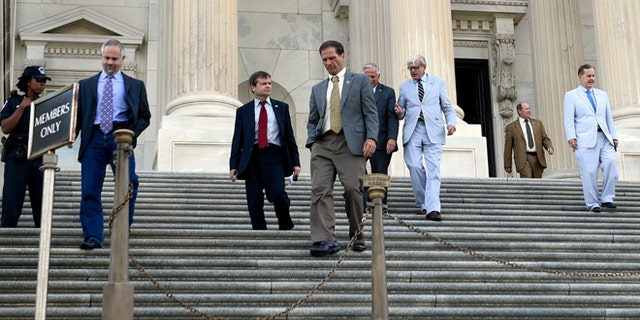 FILE: July 29, 2015: House members walk down the steps on Capitol Hill in Washington, D.C.