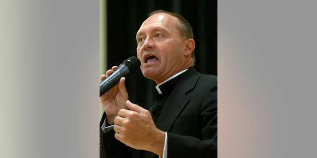 In this May 4, 2006 photo, Monsignor Kevin Wallin speaks at the Catholic Center, headquarters of the Diocese of Bridgeport, in Bridgeport, Conn.