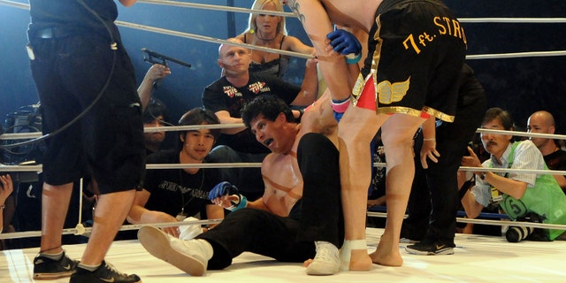 YOKOHAMA, JAPAN - MAY 26: Former Oakland Athletics slugger Jose Canseco (L) looks dejected as being defeated by Choi Hong-man at first Round of Super Hulk Tournament during Dream.9 at Yokohama Arena on May 26, 2009 in Yokohama, Kanagawa, Japan. Canseco lost at 1 minute 17 seconds in the first round. (Photo by Horoki Watanabe/Getty Images)
