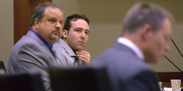William Hoehn, center, listens to the charges read against him on Wednesday, Sept. 19, 2018, in Fargo, N.D., for the murder of Savanna LaFontaine-Greywind, a 22-year-old whoss baby was cut from her womb. Hoehn is charged with conspiracy to commit murder in the death of 22-year-old Savanna Greywind, who was eight months pregnant when she was killed in August 2017. (Michael Vosburg/The Forum via AP, Pool)