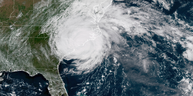 This satellite image provided by NOAA shows Hurricane Florence on the eastern coast of the United States on Friday, Sept. 14, 2018. (NOAA via AP)