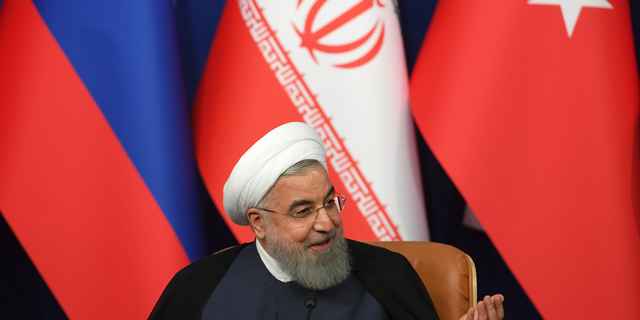Iran's President Hassan Rouhani attends a news conference following the Russia-Iran-Turkey summit in Iran on Friday, Sept. 7, 2018. (Kirill Kudryavtsev/Pool Photo via AP)
