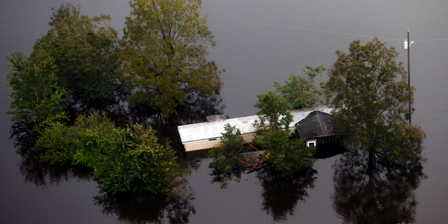 Floodwaters surround a trailer in the aftermath of Hurricane Florence in Pollocksville, N.C., Monday, Sept. 17, 2018. (AP Photo/Steve Helber)