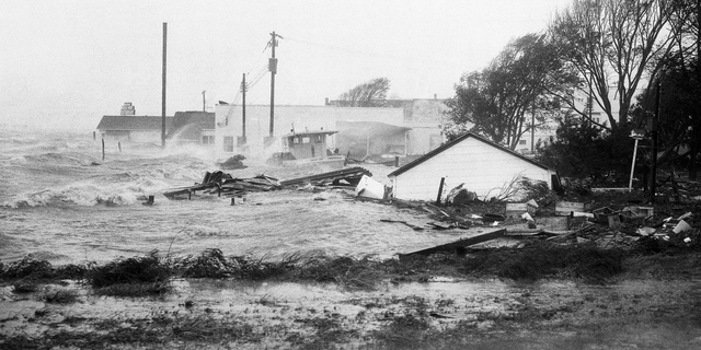 FILE-In this Oct. 15, 1954 file photo, High tides, whipped in by Hurricane Hazel, shatter boats and buildings in Swansboro, N.C., as the storm lashes the Atlantic seaboard. The last time the midsection of the East Coast stared down a hurricane like Florence, Dwight Eisenhower was in the White House and Marilyn Monroe and Joe DiMaggio were newlyweds. Florence could inflict the hardest hurricane punch the Carolinas have seen in more than 60 years, with rain and wind of more than 130 mph (209 kph). (AP Photo, File)