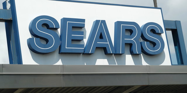 In this Saturday, July 21, 2018, photo the outdoor sign stands in the parking lot of a Sears department store in Saint Paul, Minn. Sears Holdings Corp. reports earns Thursday, Sept. 13. (AP Photo/David Zalubowski)