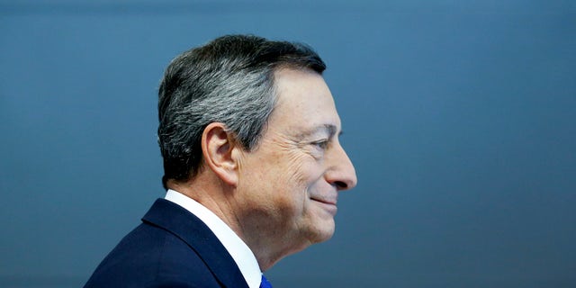 President of the European Central Bank Mario Draghi is on his way to a news conference in Frankfurt, Germany, Thursday, April 27, 2017. (AP Photo/Michael Probst)