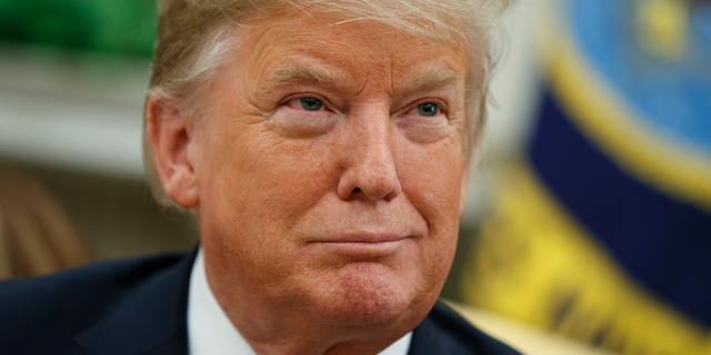 President Donald Trump smiles during a meeting with the Emir of Kuwait Sheikh Sabah Al Ahmad Al Sabah in the Oval Office of the White House, Wednesday, Sept. 5, 2018, in Washington. (AP Photo/Evan Vucci)