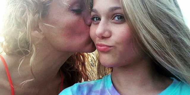 This undated photo shows Gabriella Green, 12, with her mother Tanya. Two 12-year-olds have been charged with cyberstalking in connection with Gabriella's death.