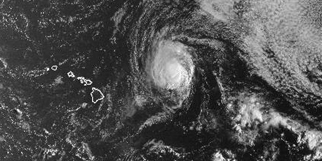 This satellite image from the National Oceanic and Atmospheric Administration shows Hurricane Olivia east of Hawaii at around 6:30 a.m. local time Monday, Sept. 10, 2018. Olivia is expected to approach Hawaii in the coming days as either a high-end tropical storm or a low-end hurricane. Central Pacific Hurricane Center meteorologist Maureen Ballard said Monday there's only a slight difference between the two, so people should prepare as though it will be a hurricane. Olivia is currently 435 miles (700 kilometers) east of Hilo and moving 9 mph (15 kph). It has maximum sustained winds of 75 mph (120 kph). (NOAA via AP)